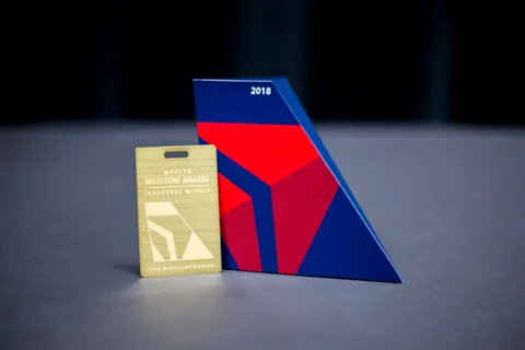 Delta Air Lines: The winner's package: a TUMI suitcase, a trophy, a brass luggage tag, a handwritten note. (3 of 3)