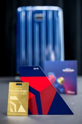Delta Air Lines: The winner's package: a TUMI suitcase, a trophy, a brass luggage tag, a handwritten note. (1 of 3)