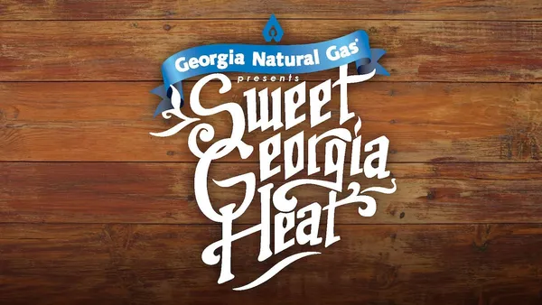 The Sweet Georgia Heat wordmark, hand-lettered in white script on weathered wood, under the Georgia Natural Gas logo